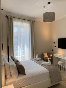 a bedroom with a large bed and a window at Golden Round Palace in Rome