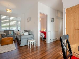a living room with a couch and a chair at The Laurels in Goodwick