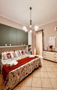a bedroom with a large bed and a mirror at Mongitore 15 in Palermo