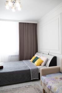 Postel nebo postele na pokoji v ubytování Апартаменты на главной улице Сыганак, рядом с Ханшатыр