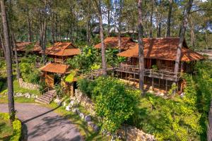 an overhead view of a house in the woods at Phoenix Mộc Châu Resort in Mộc Châu