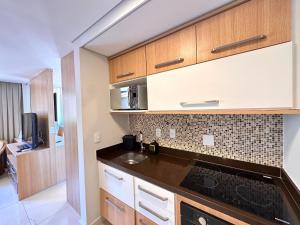 Kuchyň nebo kuchyňský kout v ubytování Estúdio Moderno na Granja Brasil – Itaipava