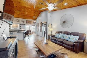 a living room with a couch and a table at Headquarters Hideaway in Fredericksburg