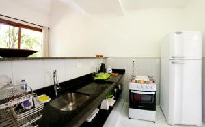 Una cocina o zona de cocina en Manacá Flat