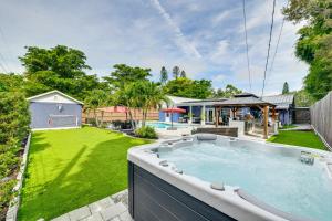 a hot tub in the backyard of a house at Backyard with Pool and Games! Family Home in Bradenton in Palma Sola Park