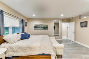 a bedroom with a large bed and a window at Backyard with Pool and Games! Family Home in Bradenton in Palma Sola Park +23 photos