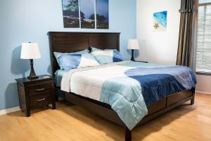 a bedroom with a bed and a nightstand with two lamps at The Breeze in Navarre