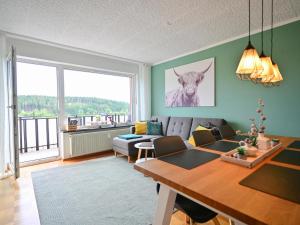 a living room with a couch and a table at Bärenhöhle in Marktleuthen