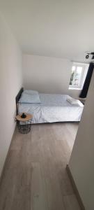 Ένα ή περισσότερα κρεβάτια σε δωμάτιο στο Appartement 4 personnes