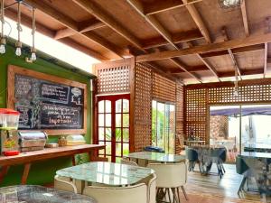 a restaurant with green walls and tables and chairs at Hotel Boutique Parque Brasil in Antofagasta +34 photos