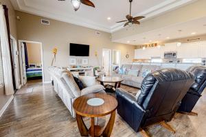 a living room with a couch and a table at Ultimate Steps to Beach Large Deck Dog Haven in Crystal Beach