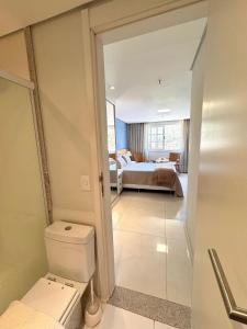 Postel nebo postele na pokoji v ubytování Estúdio Moderno na Granja Brasil – Itaipava