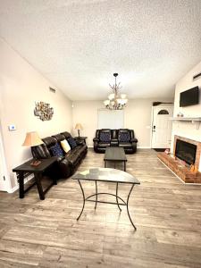 a living room with a couch and a fireplace at Home Away from Home in Fitzgerald