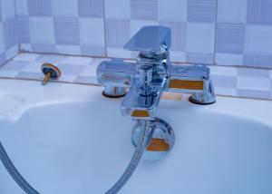 a faucet in a bathroom with a sink at cyro reservations in Nalakonge +15 photos