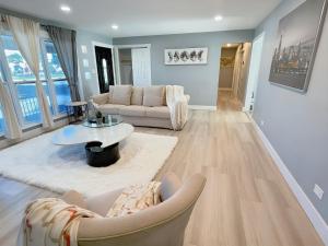 a living room with a couch and a table at Comfort Meets Convenience in Schaumburg
