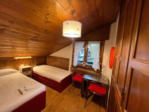 Ένα ή περισσότερα κρεβάτια σε δωμάτιο στο Apartment 5 Torri, tipico attico a Cortina