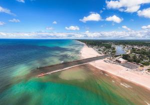 an aerial view of a beach and the ocean at Luxury Home with Harbor Views Hot Tub Walk to North Beach Dog Friendly in South Haven