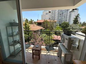 a balcony with a view of a city at Spacious City Center - Suite 203 in Nicosia