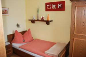 A bed or beds in a room at Haus Regina