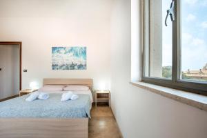 Postel nebo postele na pokoji v ubytování Casa Corso Mare Villa