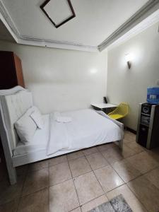 Ένα ή περισσότερα κρεβάτια σε δωμάτιο στο Abby's City Studio +4 φωτογραφίες