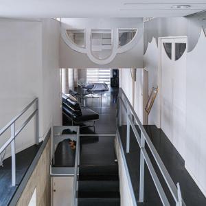 a room with stairs and a hallway withwindows and a stair case at A rental house where you can stay in a residential - Vacation STAY 18763 in Honchō