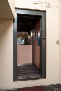 an entrance to a building with a revolving door at Hotel Terranort in Iquique