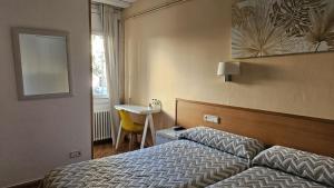Ένα ή περισσότερα κρεβάτια σε δωμάτιο στο Hostal Rio De Castro