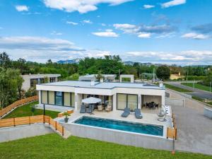 an aerial view of a house with a swimming pool at Sunset Villa Santalezi in Santalezi