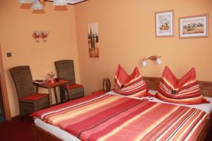 A bed or beds in a room at Haus Regina