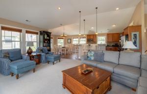 a living room with a couch and a table at Show Boat in Kitty Hawk