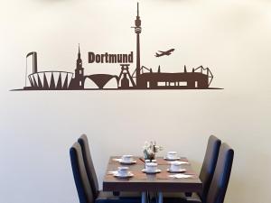 a dining room table with a sign that reads dont disturb at Sunday Hotel Dortmund City in Dortmund