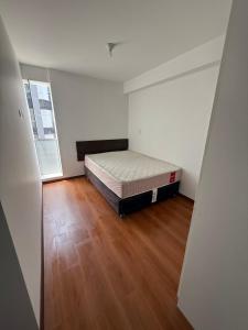 Ένα ή περισσότερα κρεβάτια σε δωμάτιο στο Departamento San Sebastian