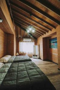 a large room with two large beds in it at Baja Vineyard Lodge - Luxury in Valle de Guadalupe with pool in Ensenada
