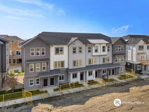 an aerial view of a building in a city at Modern Luxury Townhome near Aspen Landing and Winsport in Calgary
