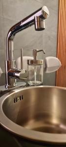 a sink with a faucet and a glass of water at CASA DON JULIAN in Oaxaca City +64 photos