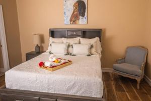 a bedroom with a bed with a stuffed animal on it at Spacious Luxury Estate Pool Jacuzzi Horses in Orlando