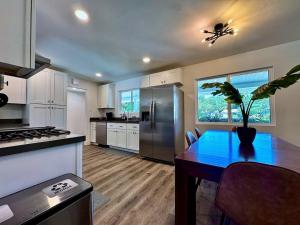 a kitchen with a table with a potted plant on it at Pool Remodeled 4 Bedroom Carmichael Home in Carmichael