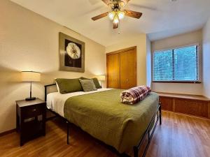 a bedroom with a bed and a ceiling fan at Forest View Family Home in Pollock Pines