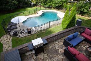 an overhead view of a swimming pool in a yard at Lakeview on Main Pool Fire Pit and Walkable in Geneva