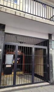 a building with a window with bars on it at Neptuno VI in Mar del Plata
