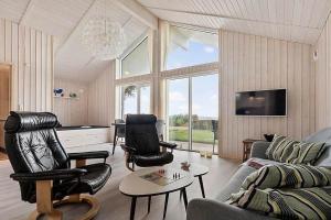 a living room with two chairs and a couch at SJ308-Sjolund-Gl-Strandvej-29 in Binderup Strand