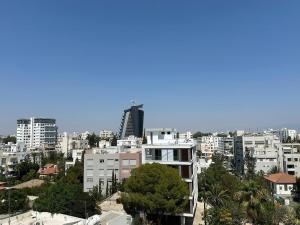 a view of a city with tall buildings at Suite 52 - Two Bedroom Apartment with Shared Pool in Nicosia