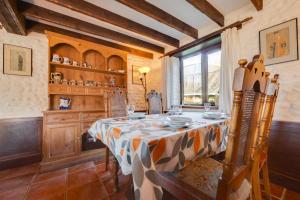 a dining room with a table and a window at Pilgrims Prospect in Bacton