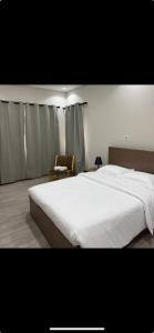 Ένα ή περισσότερα κρεβάτια σε δωμάτιο στο CozyHomes