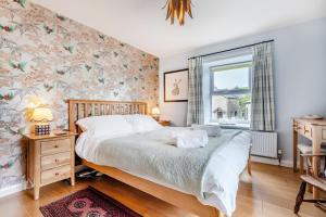 a bedroom with a bed and a window at Hill View in Appersett