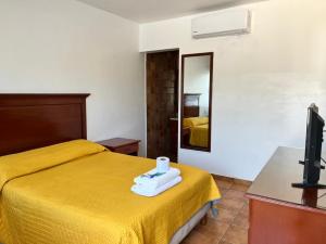 Postel nebo postele na pokoji v ubytování Resort Misión del Mar