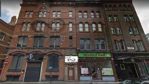a large red brick building with a moroccan bar at Infinity Partypadsliverpool Hen And Stag Welcome in Liverpool