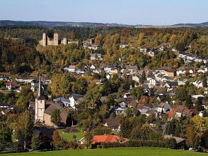 an aerial view of a small town with a castle at Feriendorf Reinskopf in der Eifel in Schönecken +27 photos