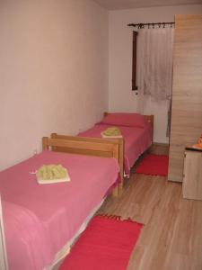 Postel nebo postele na pokoji v ubytování Apartments Alen